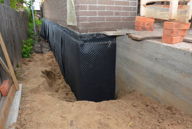 Happy homeowners after waterproofing job in Lumberville